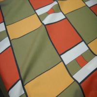 Coton imprime ton kaki orange safran en 1 60m de large