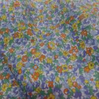 Coton popeline blanche imprime liberty fleurs bleu jaune orange