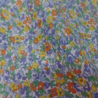 Coton popeline blanche imprime liberty fleurs bleu jaune orange