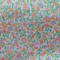 Coton popeline blanche imprimé liberty fleurs ton vert ,mauve et orange