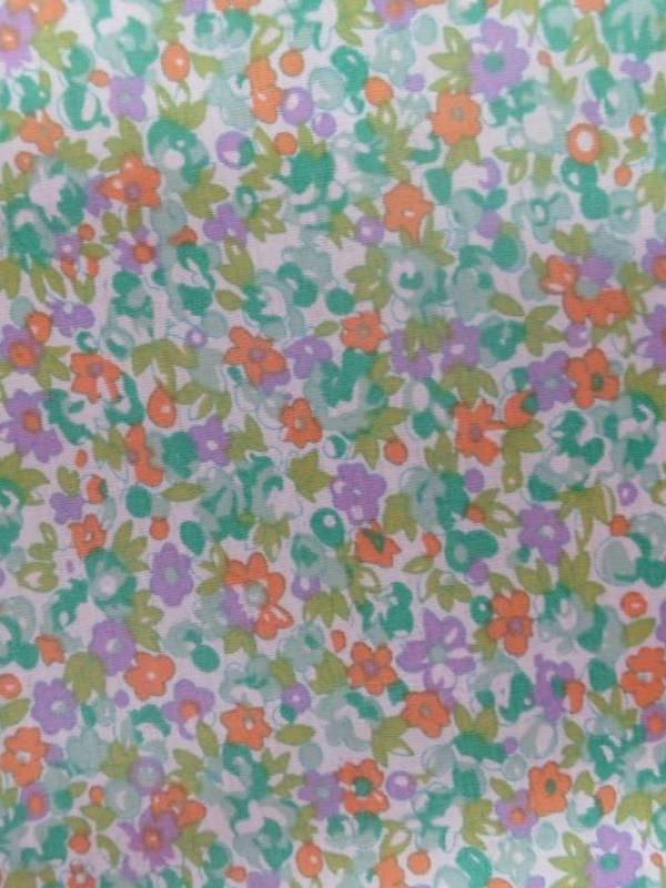 Coton popeline blanche imprimé liberty fleurs ton vert ,mauve et orange