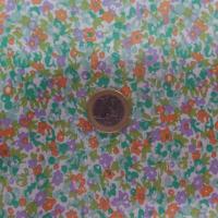 tissu Coton popeline blanche imprime liberty fleurs ton vert mauve et orange
