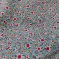 Coton popeline bleu lagon imprimé liberty fleurs ton blanc et rouge