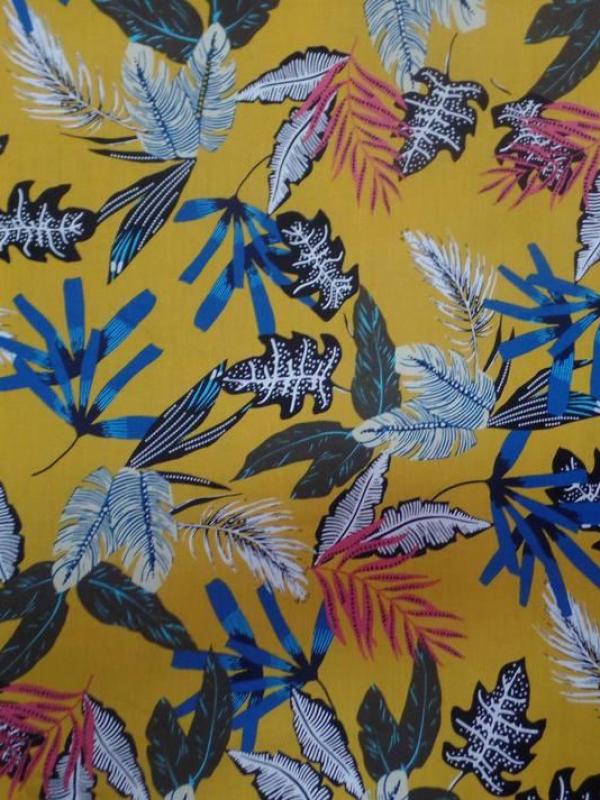 Coton popeline moutarde imprime feuillages ton blanc bleu noir