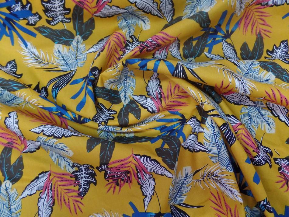 Coton popeline moutarde imprime feuillages ton blanc bleu noir0