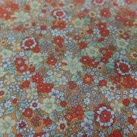 Coton popeline orange imprime liberty motifs petite fleurs
