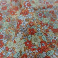 tissu coton popeline orange imprime liberty motifs petite fleurs