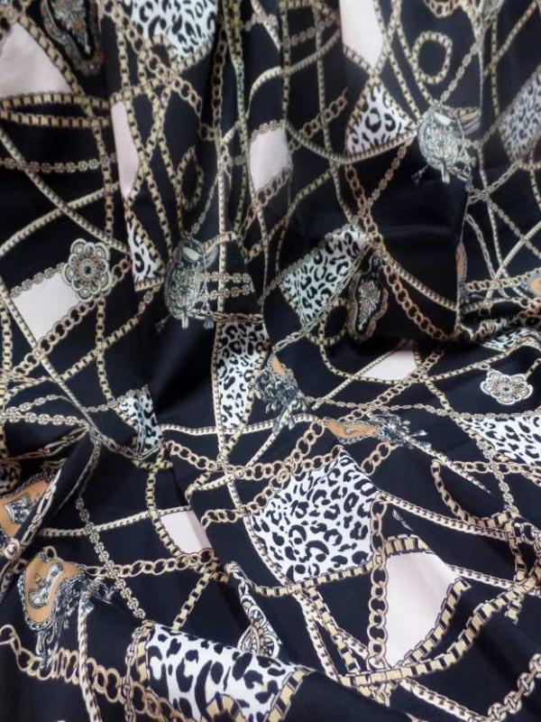 Coupon de gabardine coton lycra noire imprime dore 1 80m