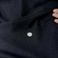 Coupon de tergal noir a petit carreaux 1 30m3