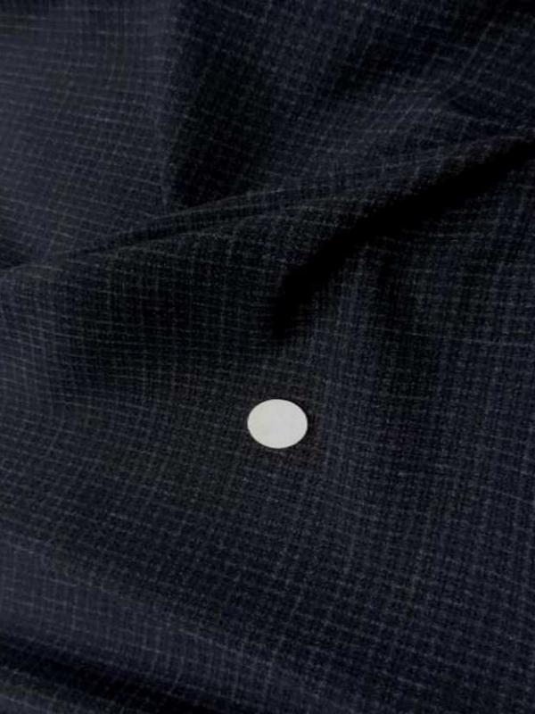 Coupon de tergal noir a petit carreaux 1 30m