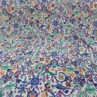 Crépon viscose blanche imprimé ton bleu vert orange fils lurex doré