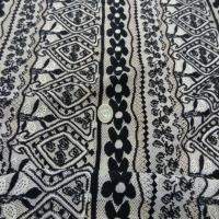 vente de tissu dentelle beige a motifs noir
