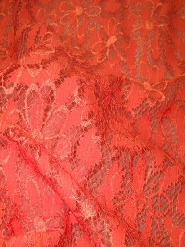 Dentelle brode sur resille ton orange