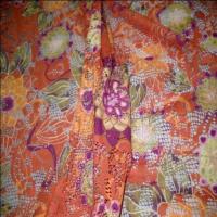 Dentelle lycra imprime fleurs ton orange