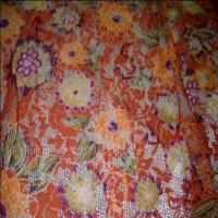 Dentelle lycra imprime fleurs ton orange0