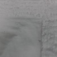 Fausse fourrure blanche montée sur gabardine en coton