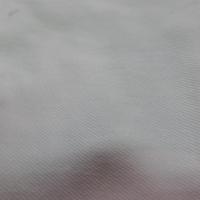 Fausse fourrure blanche montée sur gabardine en coton