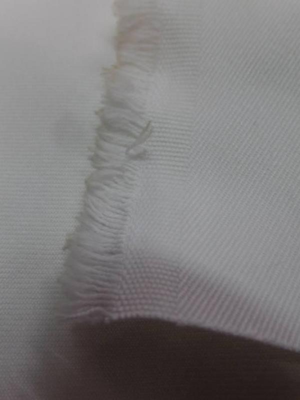 Gabardine coton 100% blanc légèrement cassé 205 gr m²