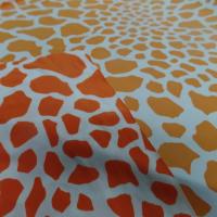 lycra-double-face-imprime-girafe-ton-orange-et-blanc