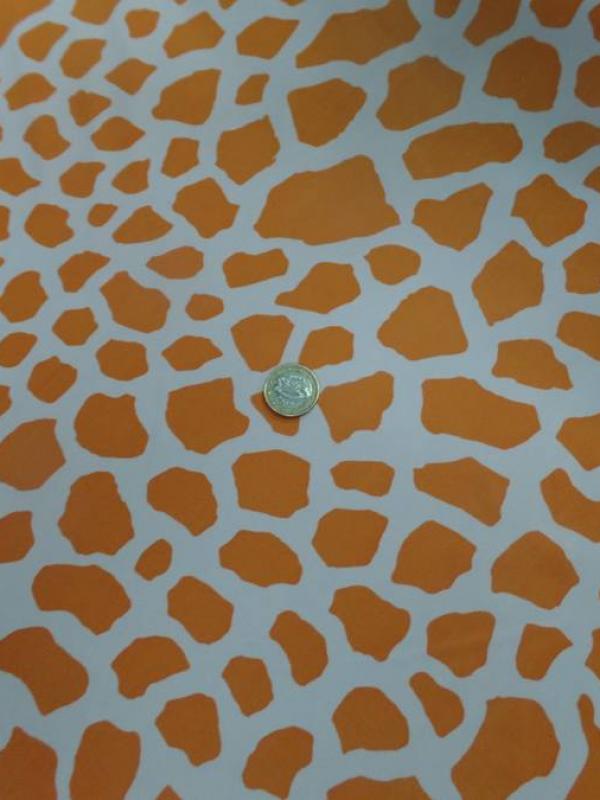 tissu Lycra double face girafe ton orange et blanc
