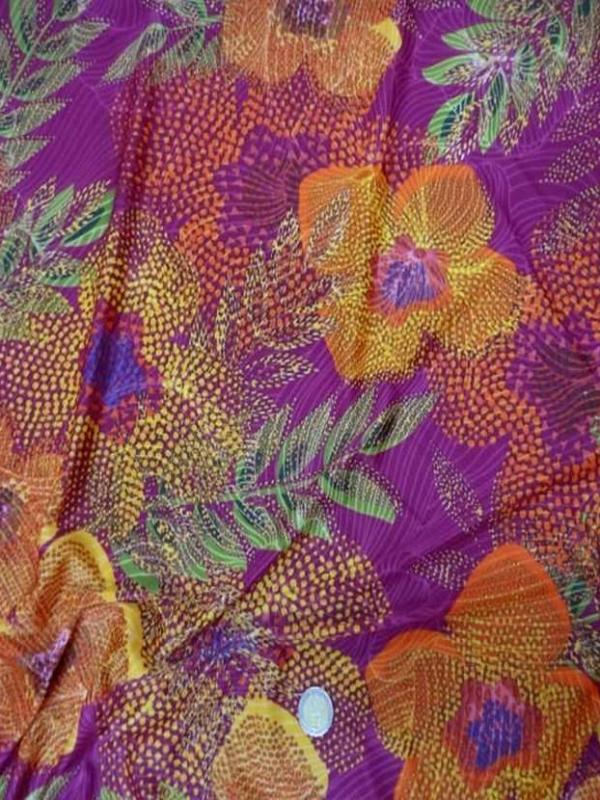 Lycra fuchsia imprime fleurs orange