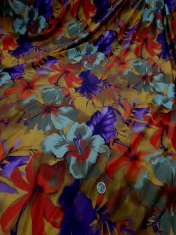 Lycra imprime fleurs safran prune
