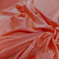 Lycra orange satine a petit pois noir