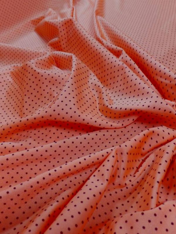 Lycra orange satine a petit pois noir
