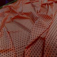 Lycra satine orange a pois noir