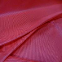 Lycra uni brillant a cotes saumon