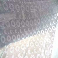 Mousseline a motifs devore blanc casse en polyester
