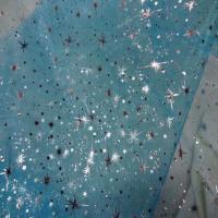 Organza bleu turquoise a etoiles couleur metal