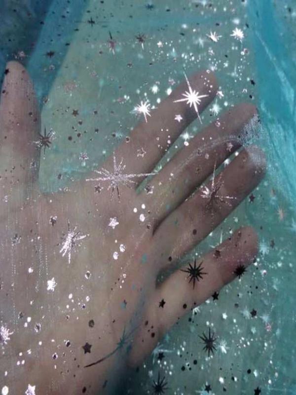 Organza bleu turquoise a etoiles couleur metal