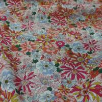 popeline coton 100% imprimé fleurs ton rouge,orange,bleu