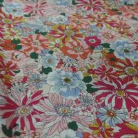 popeline coton 100% imprimé fleurs ton rouge,orange,bleu