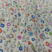 Popeline coton jaune clair 100 imprime fleurs ton bleu vert orange