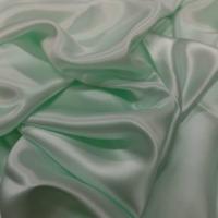 Satin de soie vert clair reflets blanc