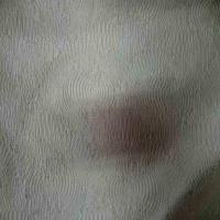 Soie 100 faconne mastic sur font gris