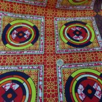 vente de tissu AFRICAIN WAX rouge imprimé jaune ,noir au mètre
