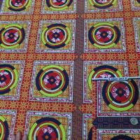 vente de tissu africain Wax rouge imprimé jaune ,noir au mètre pas cher