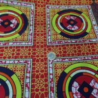 vente de tissu africain Wax rouge imprimé jaune ,noir au mètre sur Marseille