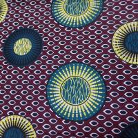 Tissu wax bordeaux imprime ton bleu noir jaune