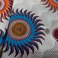 vente de tissu wax blanc imprimé soleil ton bordeaux ,orange ,jaune ,bleu