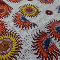 vente de tissu wax blanc imprimé soleil ton bordeaux ,orange ,jaune ,bleu