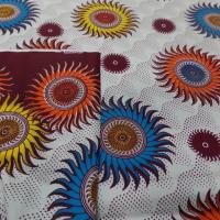 achat tissu wax blanc imprimé soleil ton bordeaux ,orange ,jaune ,bleu