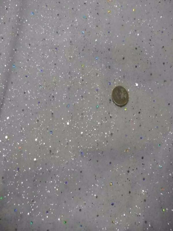 Tulle blanc a paillettes multicolore