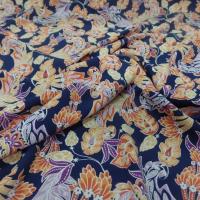 tissu Viscose bleu nuit imprimé fleurs ton jaune, orange, prune