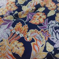 tissu Viscose bleu nuit imprimé fleurs ton jaune, orange, prune