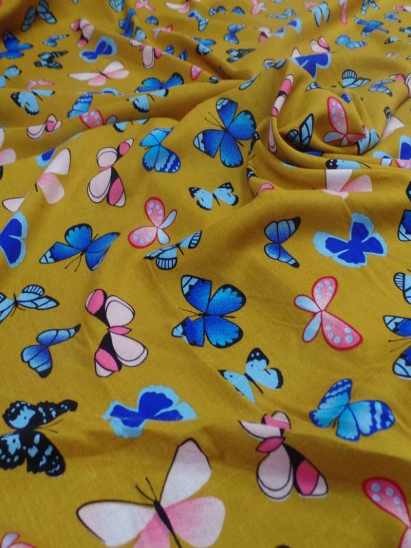 Viscose moutarde fine imprime papillon bleu et rose